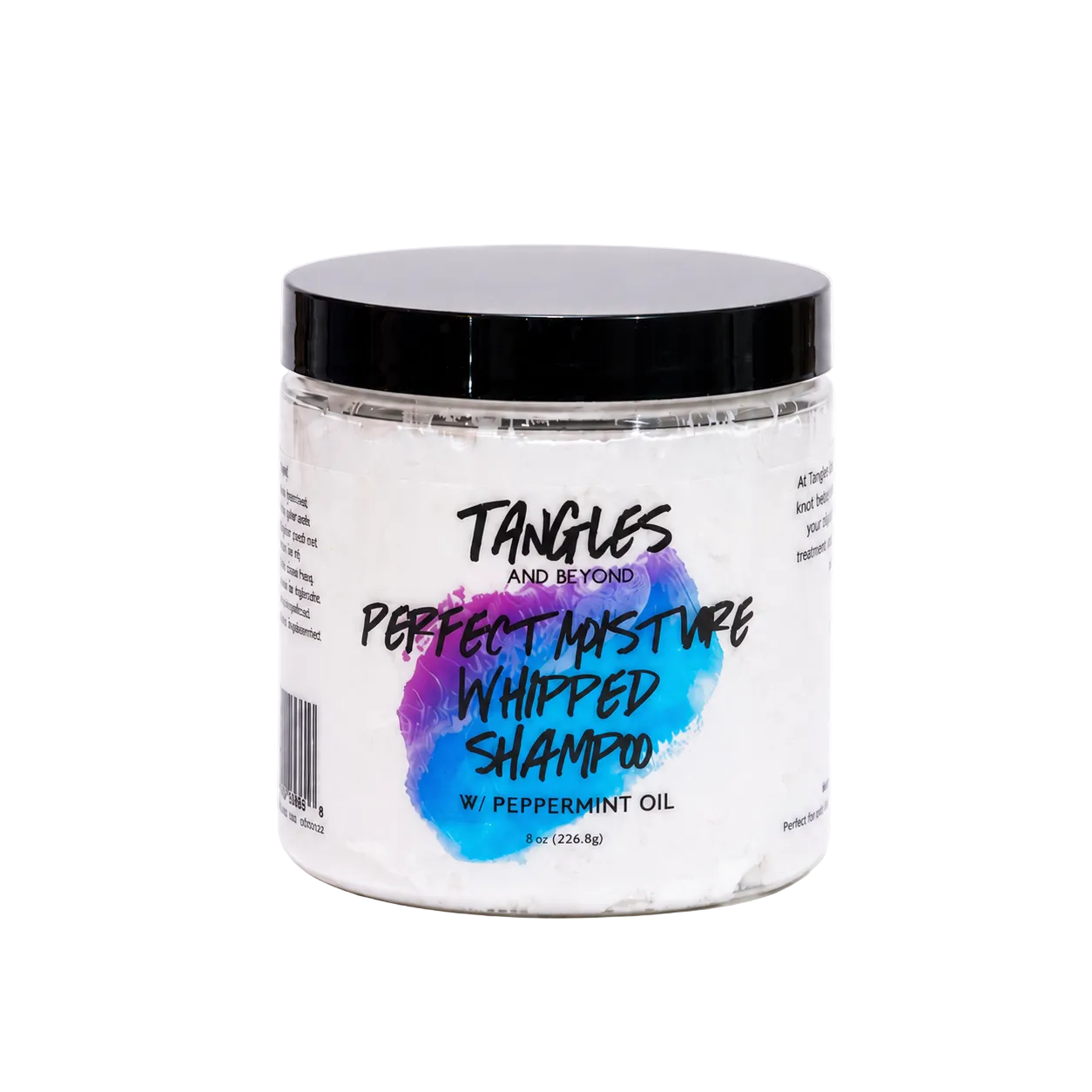 A jar of Tangles and Beyond Perfect Maturity Whipped Shampoo with Peppermint Oil, featuring a white whipped product inside a clear jar with a black lid and a colorful blue and purple splash graphic on the label.