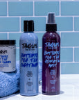 Tangles and Beyond hair care products on a tiled bathroom counter