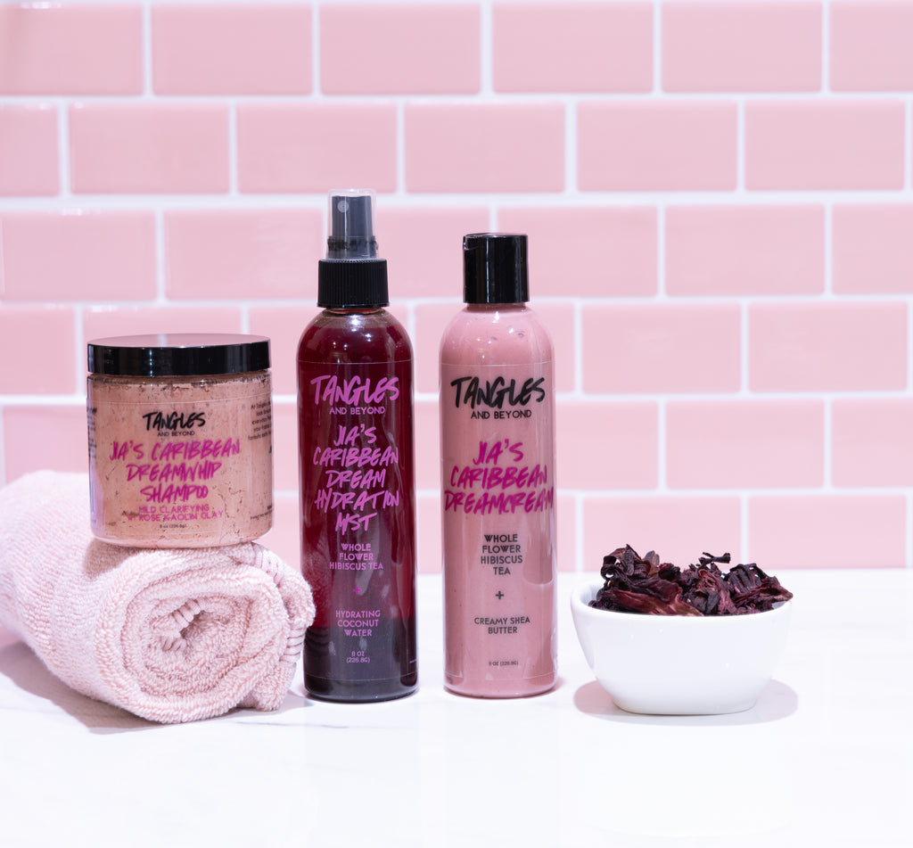 Tangles hair care products with a pink tiled background