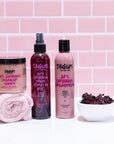 Tangles hair care products with a pink tiled background