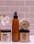 Bathroom setting with Tangles hair care products against a tiled wall.