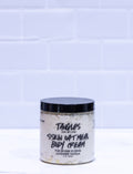 Jar of Tangles and Beyond skin oatmeal body cream on a white background