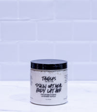 Jar of Tangles and Beyond body latte on a white tiled background